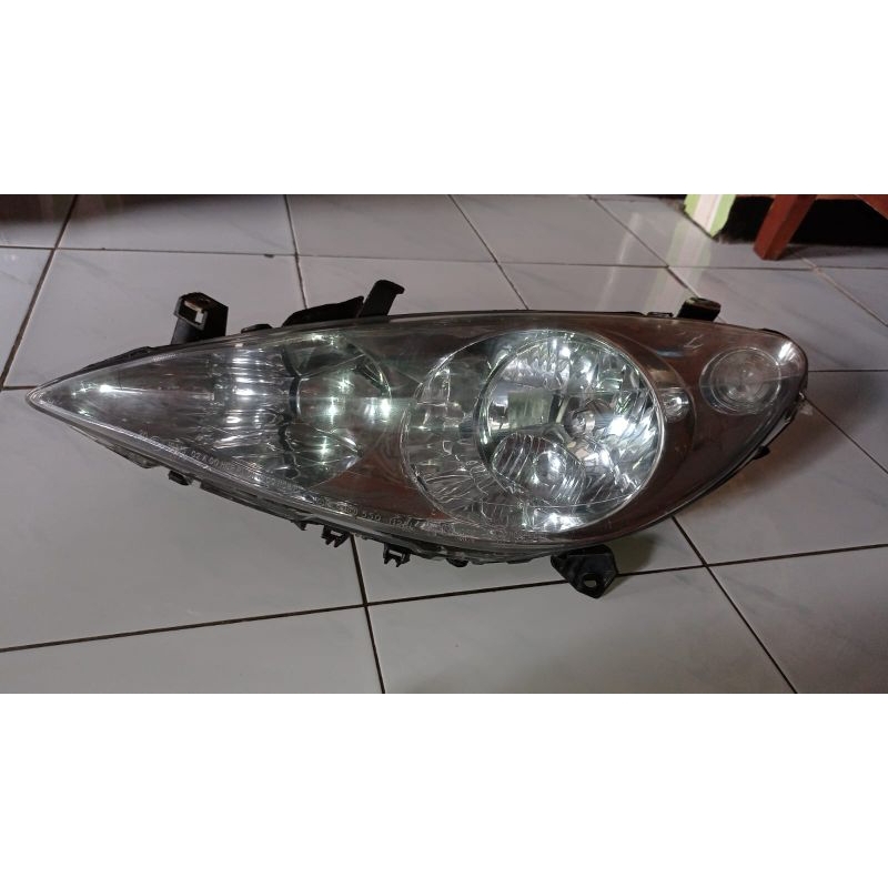 Lampu depan Peugeot 206 kiri