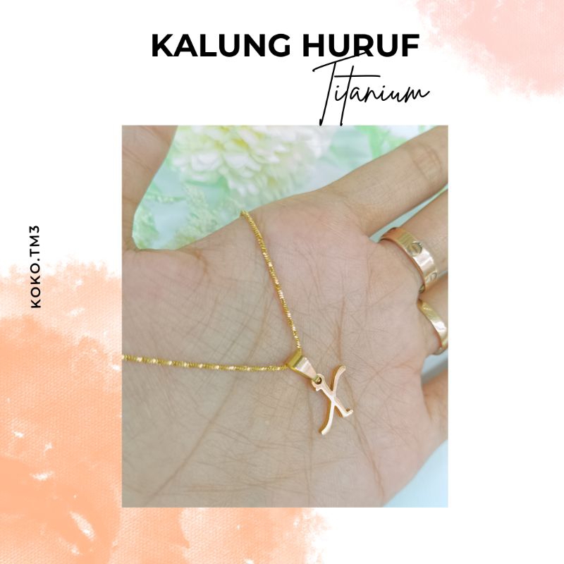 (RGZ59E)Kalung Huruf Wanita Titanium Emas
