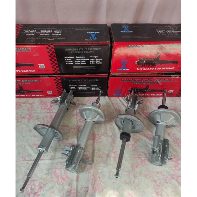 SHOCKBREAKER MOBIL MAZDA FAMILIA/LANTIA DEPAN & BELAKANG (OLI) MERK FCS