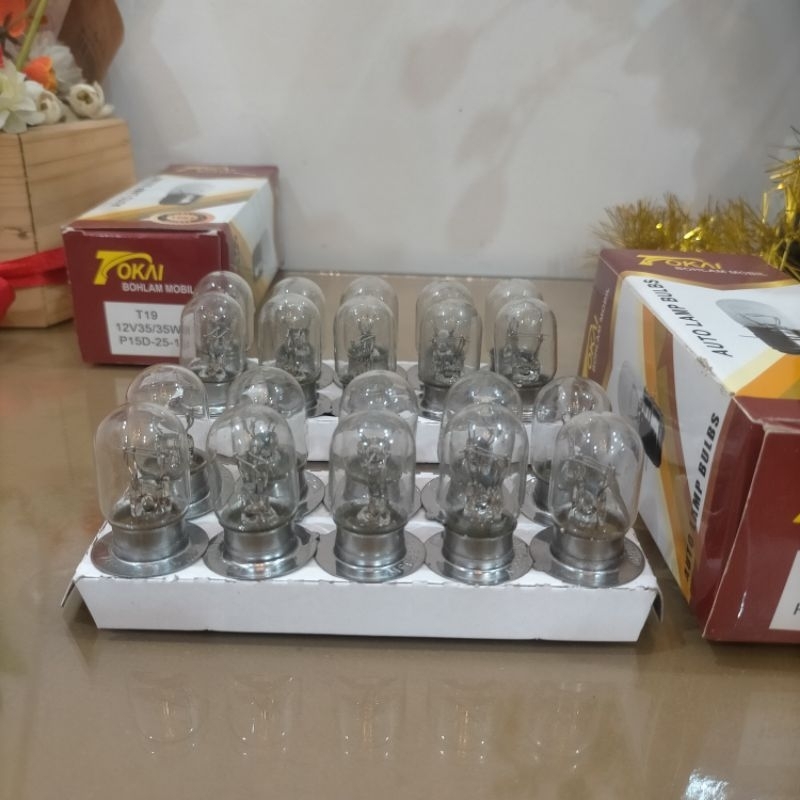 Dop / Bolam Lampu Depan Sepeda Motor T 19 Merk Tokai Model Putar kaki 2 12volt