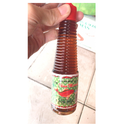 

Kecap ikan Djoehoa (botol meja) cap ikan merah djoe hoa