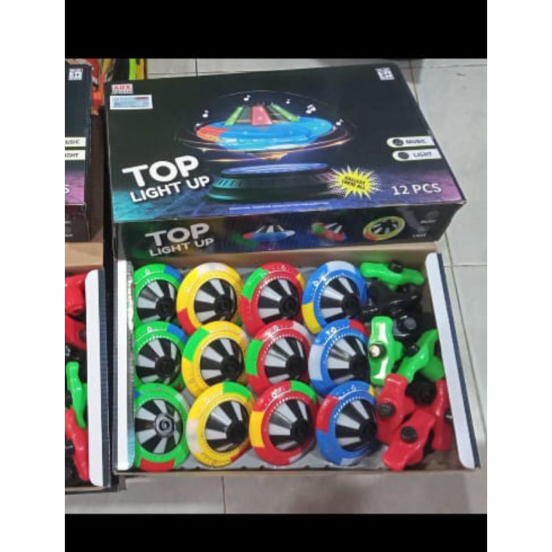 mainan gangsing musik dan lampu laser