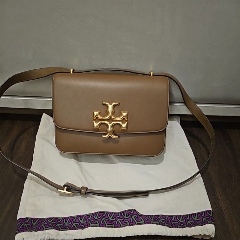 keep an preloved tory burch eleanor medium tan bag with db