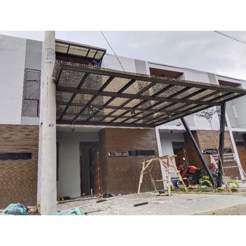 kanopi rumah atap solarflat rangka besiholo