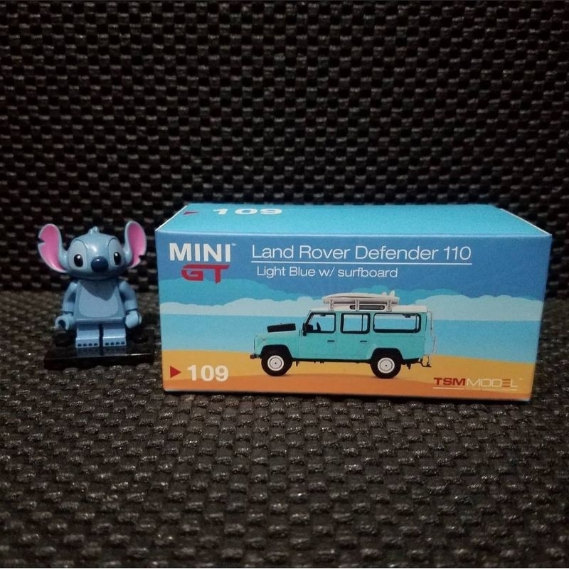 Mini gt minigt Land Rover Defender 110 Light blue with surfboard biru muda 109