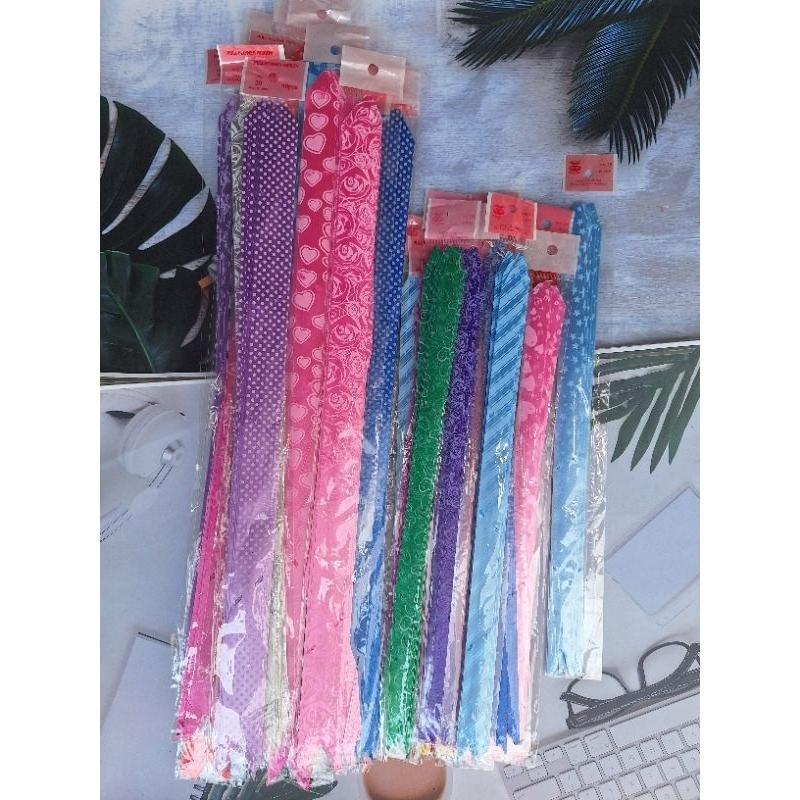 

PITA tarik MOTIF isi 10/pita warna 47Cm Dan 35 Cm/Pita Serut/Hiasan Pita/Pita Parcel