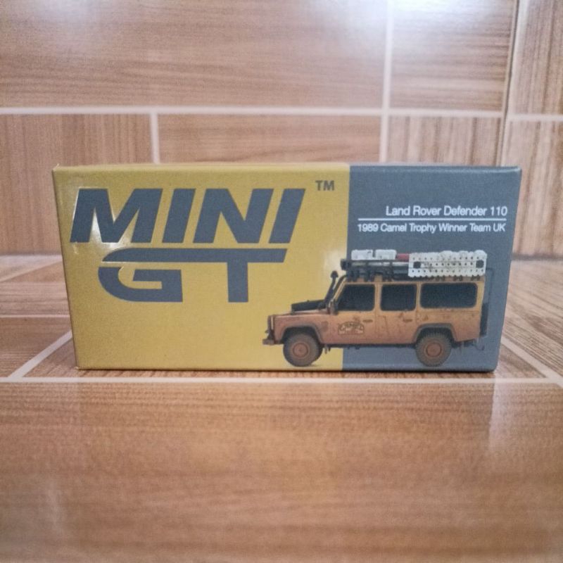 Mini GT Land Rover Defender 110 1989 Camel Thropy Winner Team UK