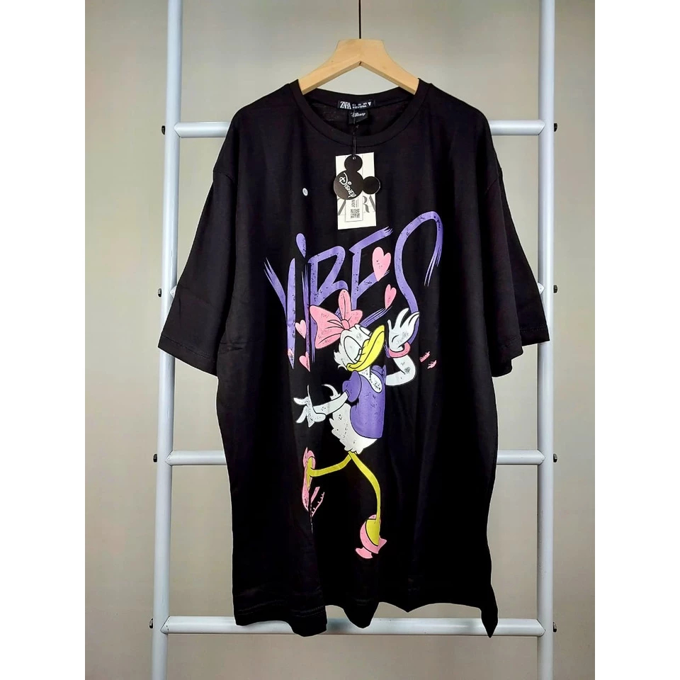 Kaos Wanita disney daisy duck lilac hitam vibes Oversize M L XL ld 100 ld 110 ld 115 Atasan Wanita Z