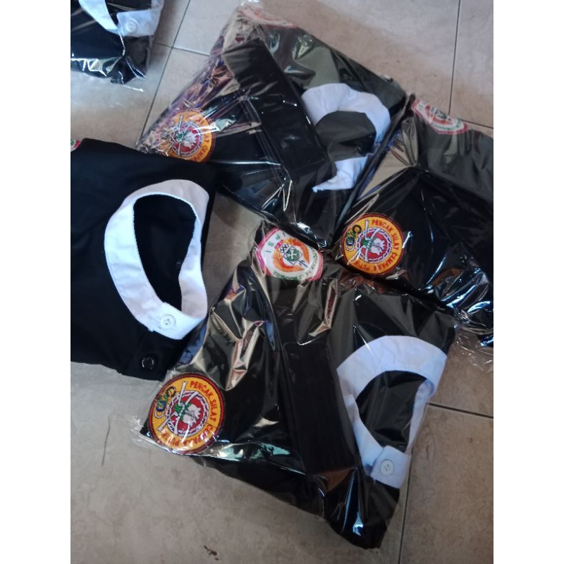 seragam sakral pencak silat cempaka putih