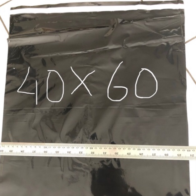 

Premium.. Polymailer hitam glossy / paking uk 40x60 ( 100 pcs ) 47