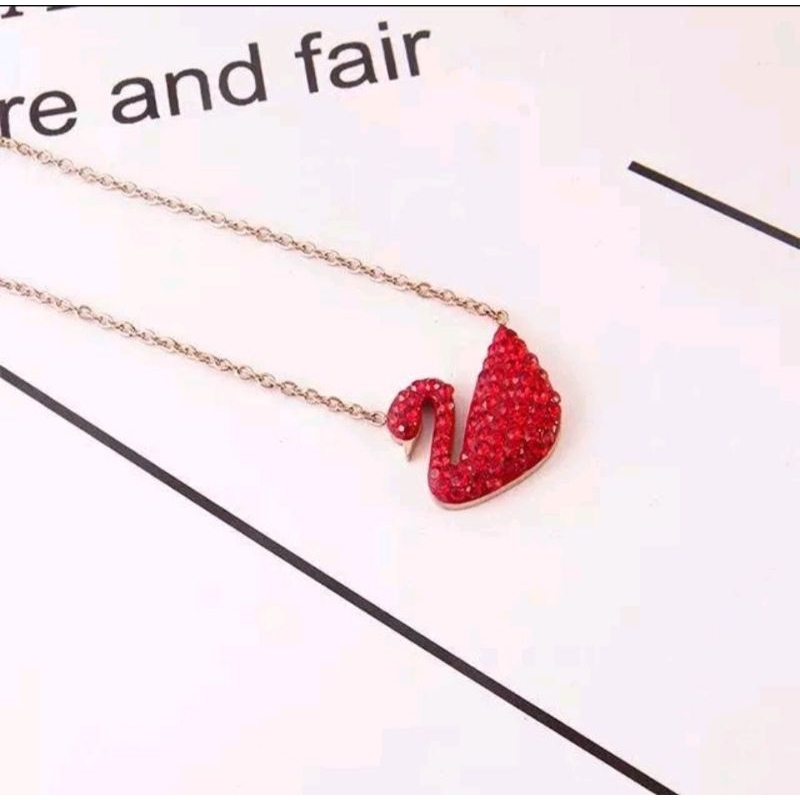 kalung titanium bebek merah