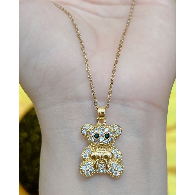 kalung titanium liontin boneka