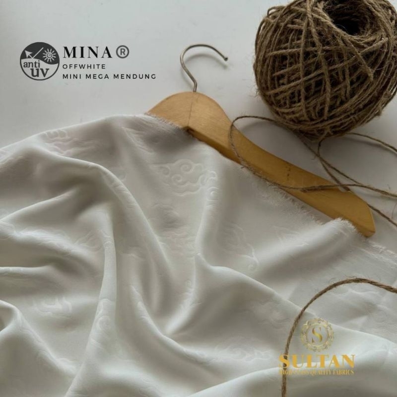Kain Sultan Mina anti uv off white emboss 50cm + bisa per 10cm