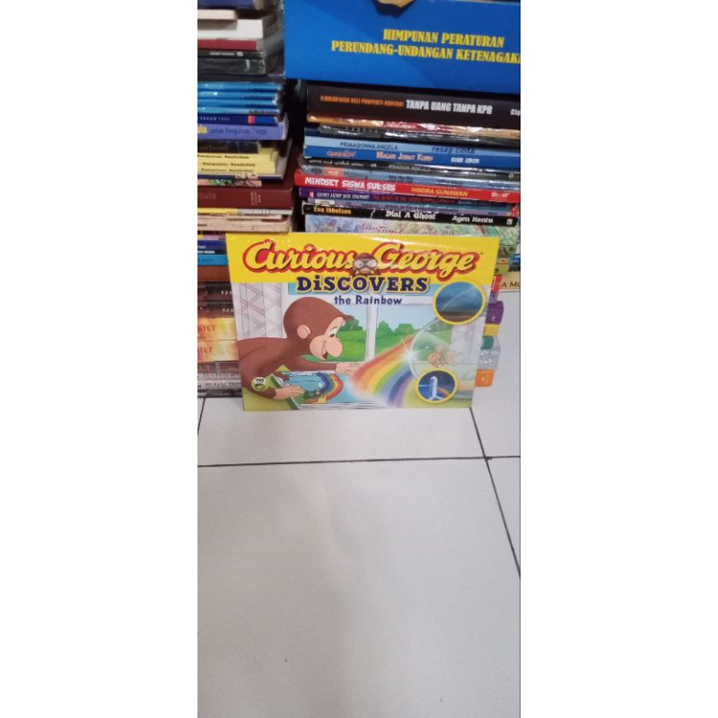 buku curious George dicovers