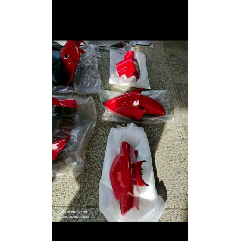 cover body halus nouvo z merah silver original
