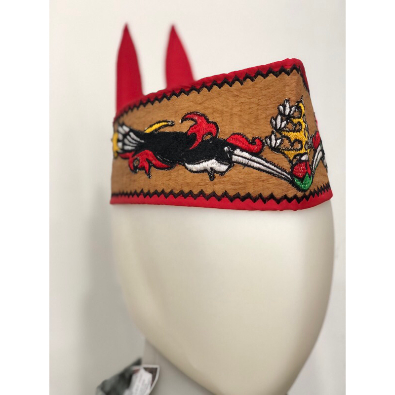 lawung dan sumping motif burung tingang khas dayak kalteng