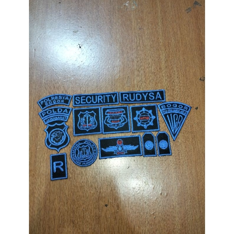 atribut bordir komputer timbul satpam biru boleh request logo Polda nama.dan nama BNN pereusahaan