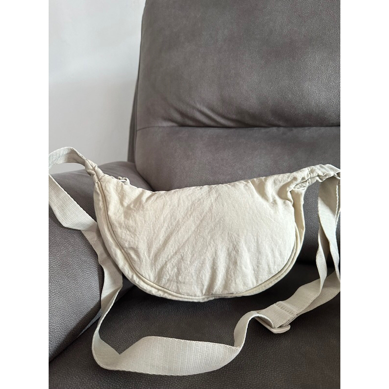 UNIQLO SLING  BAG CREAM OR BROKEN WHITE ORIGINAL PRELOVED