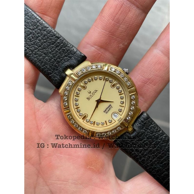 Bulova 23k gold-plated with diamond beazle swiss quartz unisex