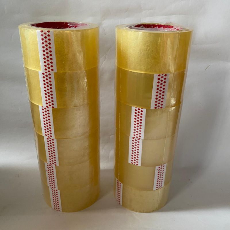 

(satu slop isi 6 rol ) Lakban Kuning Bening 2 inch 45 x 100 Yard