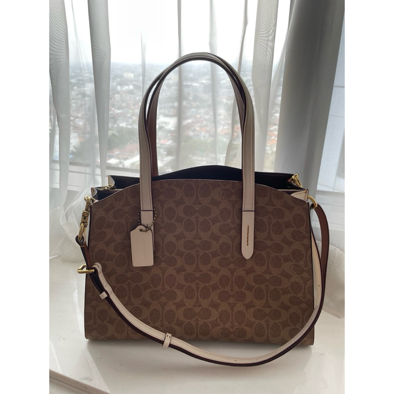 Coach Charlie Carryall in Signature canvas