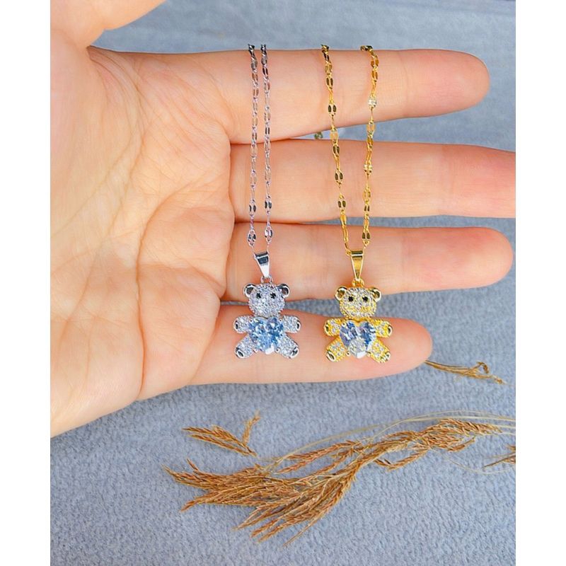Kalung titanium boneka