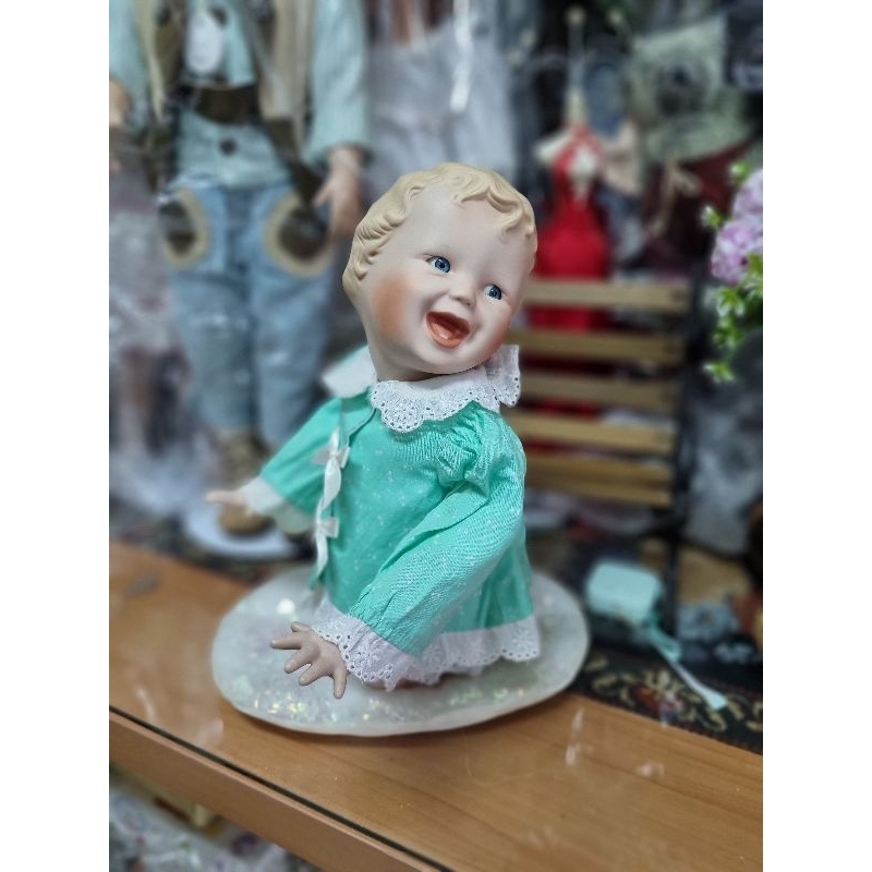 Baby sitting porcelain doll from Germany