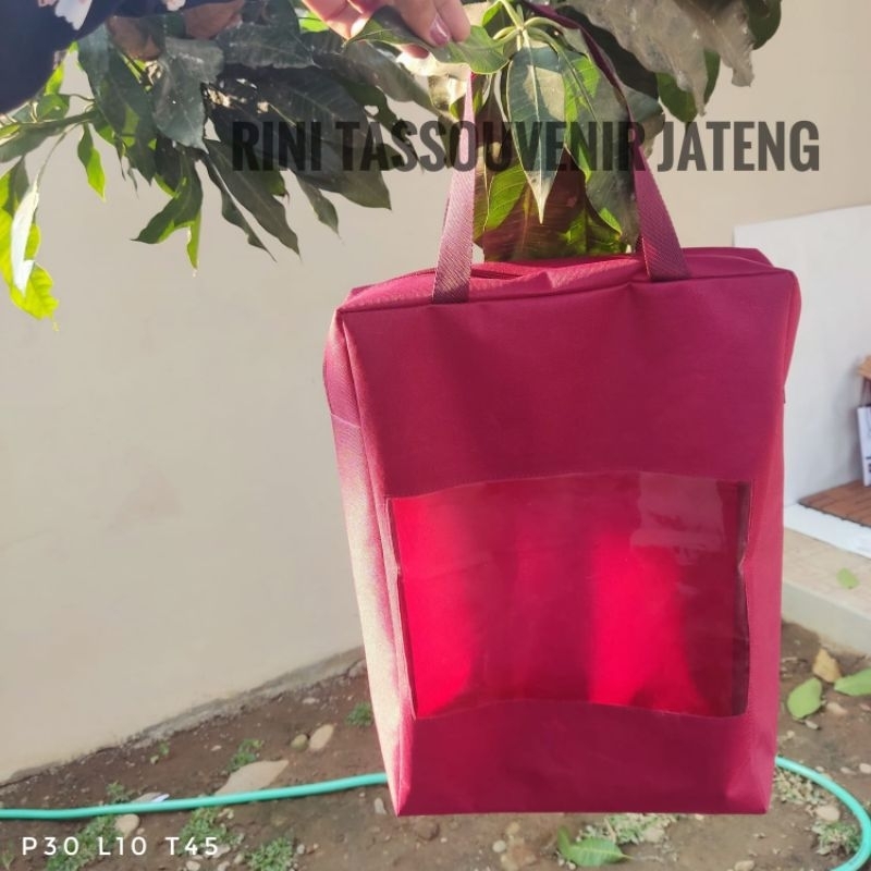 

Tas bahan polyester bagian tengah mika 0,2 pakai resleting ukuran custom