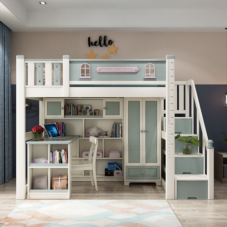 Tempat tidur tingkat bawah lemari dan meja belajar