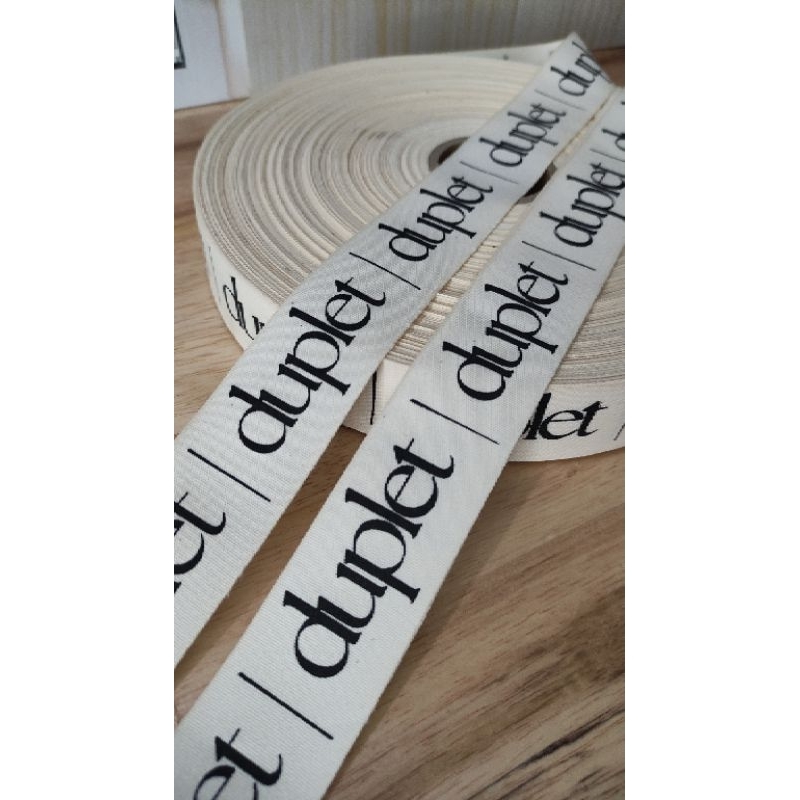 

Label Katun krem ukuran lebar 3cm