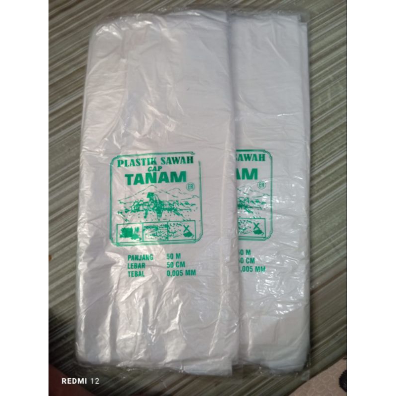 plastik meteran / plastik balon warna putih cap tanam