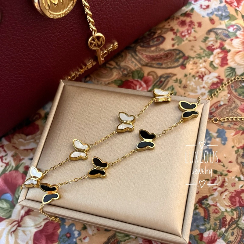 Luxious- Gelang titanium wanita kupu-kupu hitam & putih