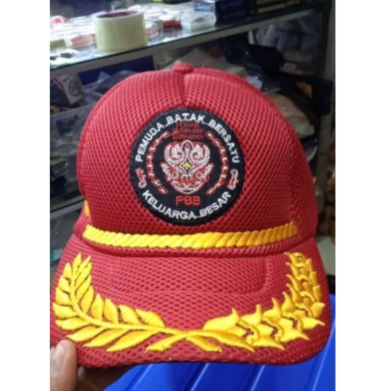 topi jaring padi kapas logo pemuda batak bersatu