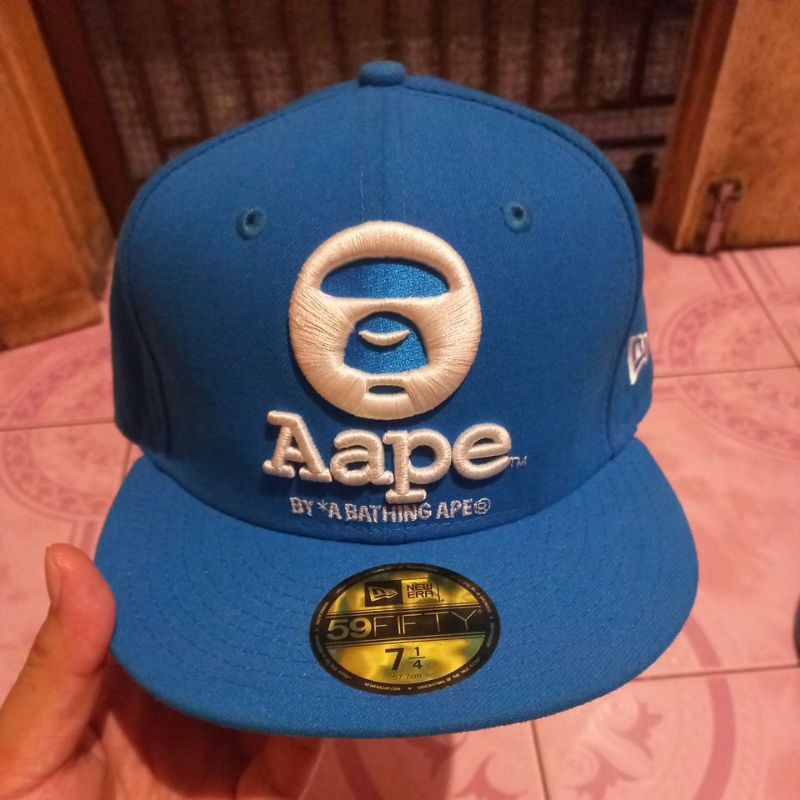 topi bape x new era