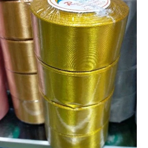 

DIJAMIN BARU Pita satin gold 2 inch 5 cm Per roll