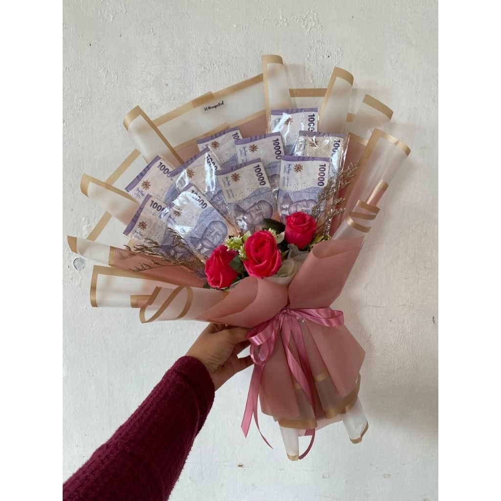 

BUKET 10 lembar uang ( kosongan ) pake bunga 3 kuntum