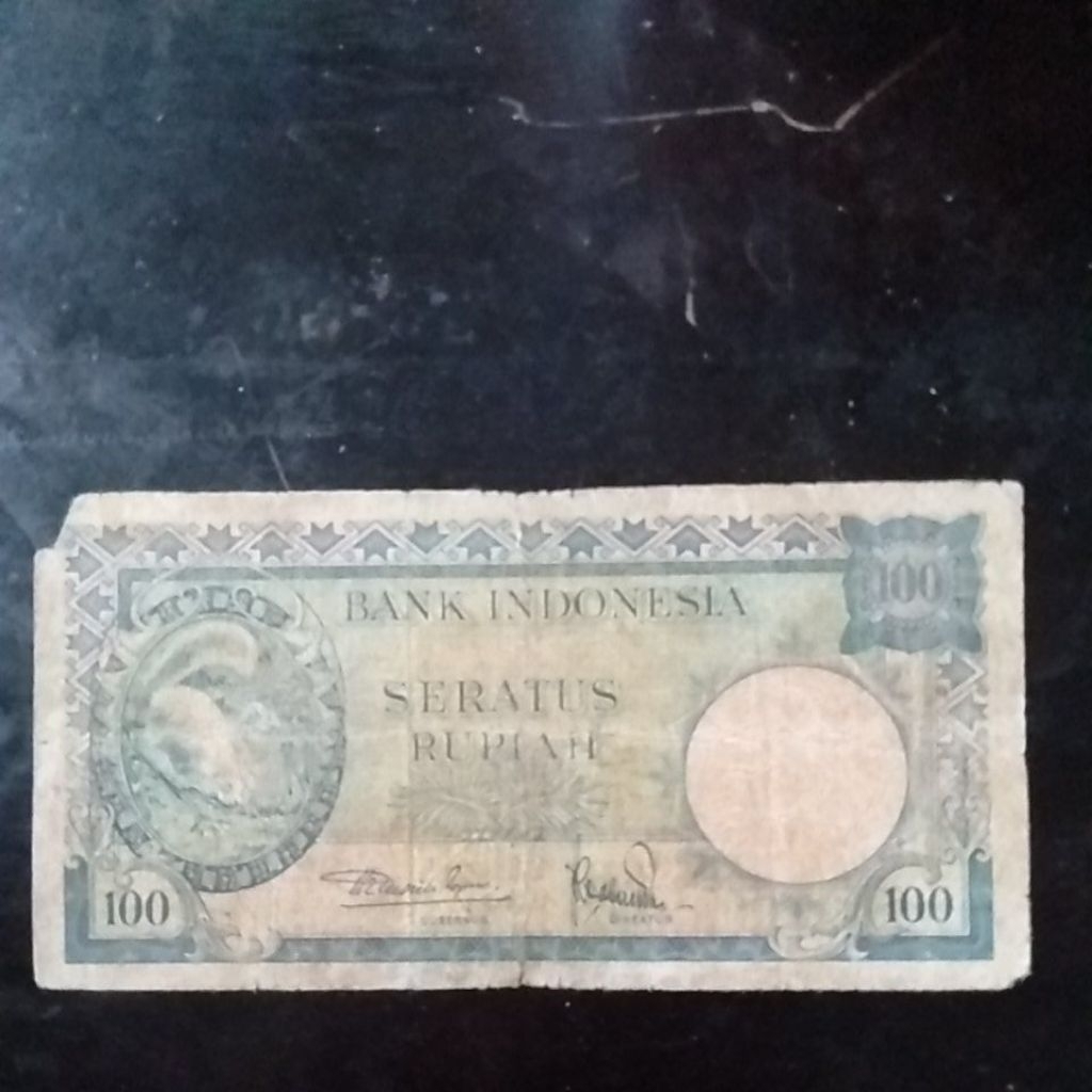 UANGKUNO 100 RUPIAH TUPAI THN 1957