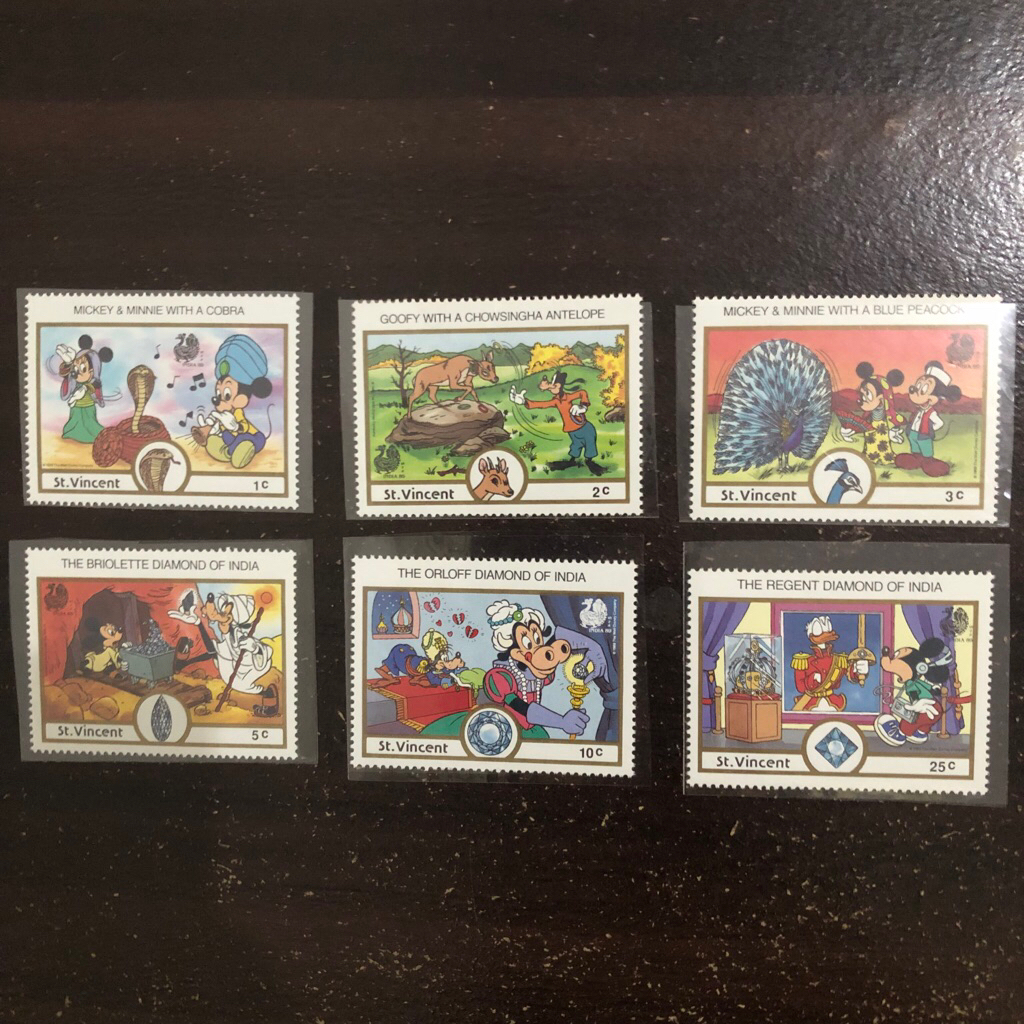 

Perangko Anak Walt Disney Company St. Vincent India Christmas Natal 1989 Mickey Minnie Mouse Cobra Goofy Chowsingha Antelope Blue Peacock Briolette Orloff Regent Diamond
