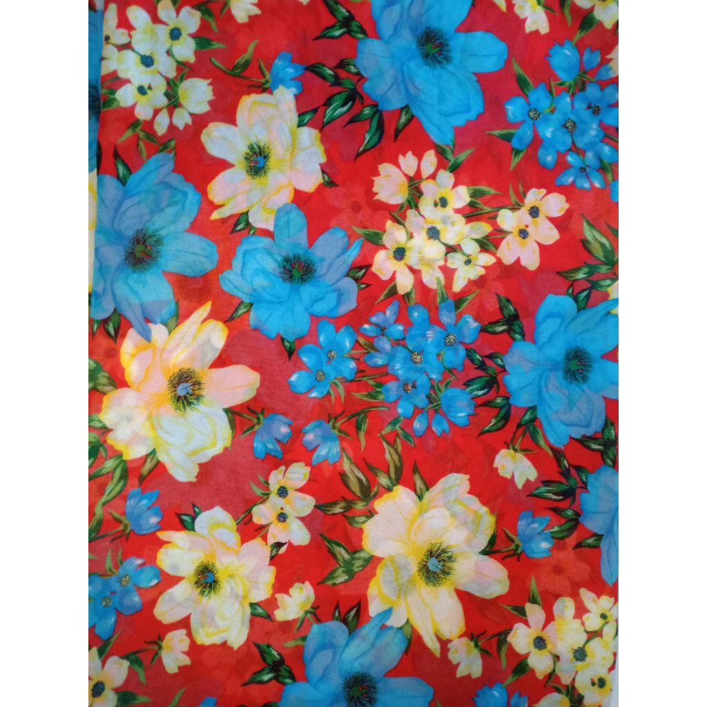 KAIN CERUTI KAIN CHIFFON TIPIS MOTIF BUNGA BIRU KUNING DASAR MERAH (REQ PANJANG 50 CM = Rp11.500)