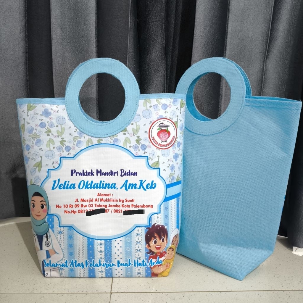 

Tas Pegangan Bulat/Hampers Klinik/Tas Promosi Bidan