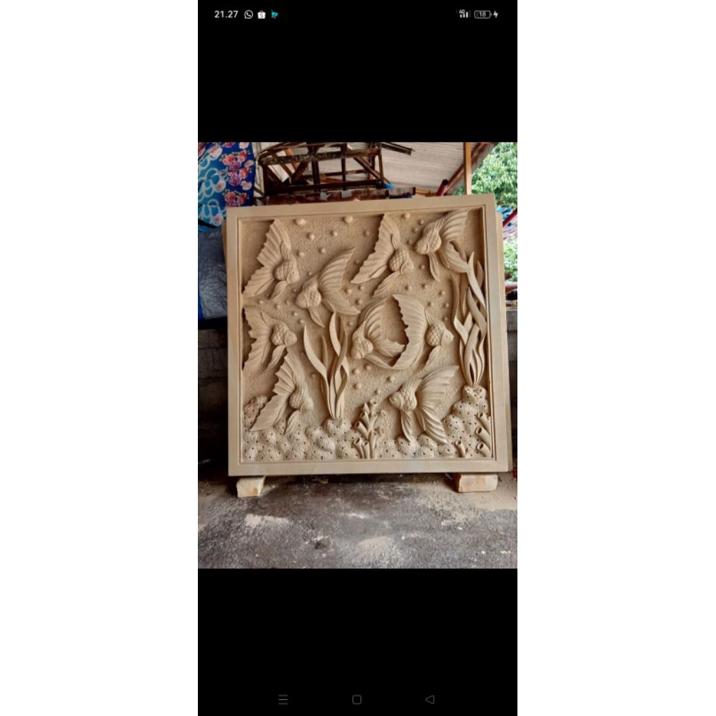 ukiran batu alam motif ikan