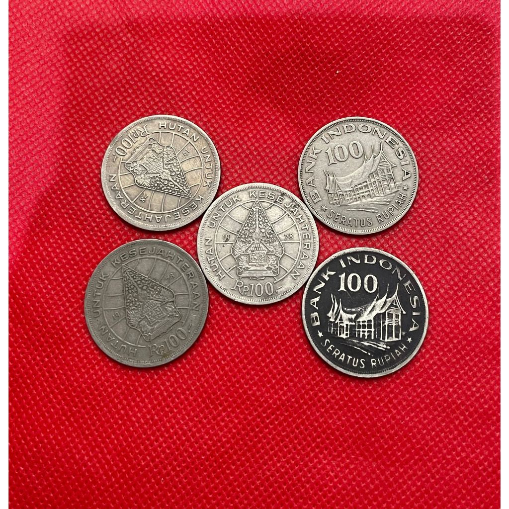 Koin kuno 100 rupiah (Rumah gadang & Wayang)
