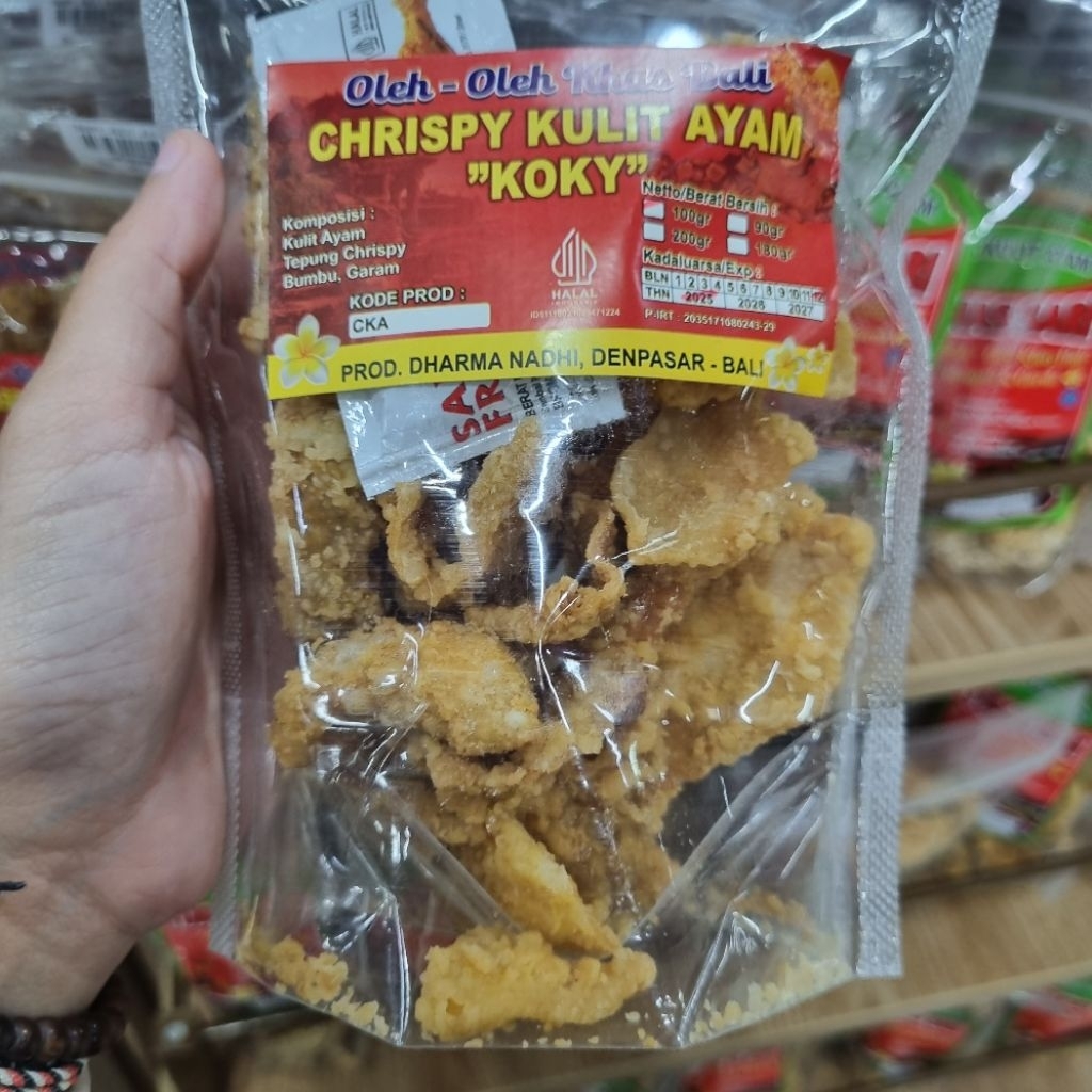 

KULIT AYAM CRISPY KOKY. KRISNA OLEH OLEH BALI. KERIPIK KULIT.AYAM