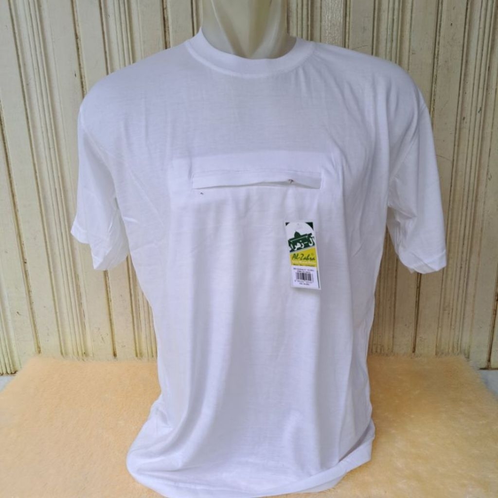 Kaos Al-Zahra Kantong Doraemon Resleting/Baju Kaos Oblong Perlengkapan Haji & Umroh
