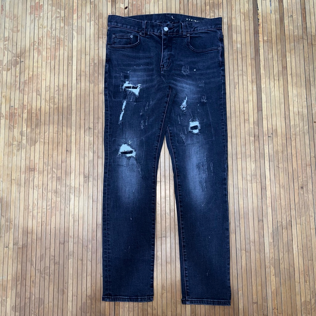 SAINT LAURENT DISTRESSED RIPPED JEANS