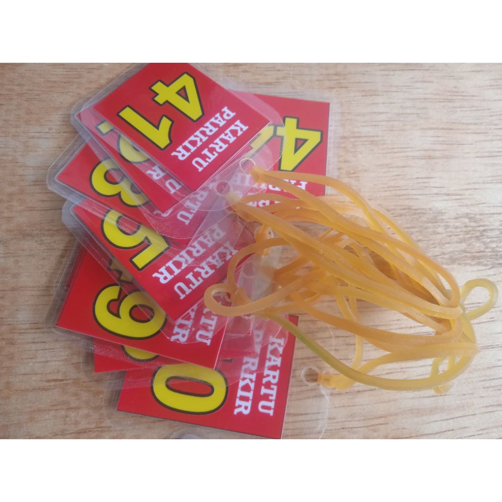 

Kartu Parkir. Bahan kertas art paper 3x4 cm. Dilapisi plastik laminating dan sudah dipasang karet pentil. Nomor 1-100 berpasangan atau dobel