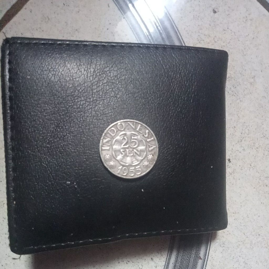 Dompet kulit 25 sen tahun 1955