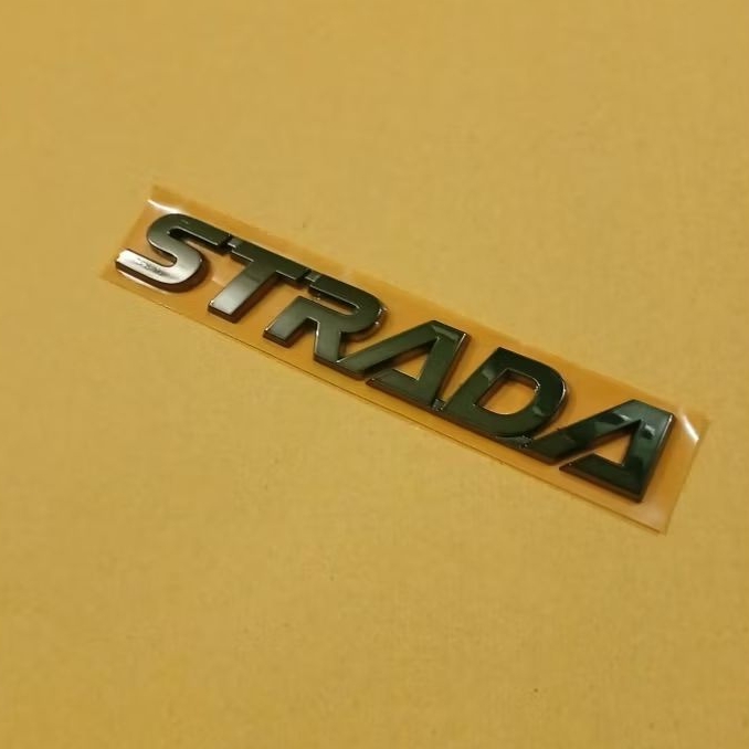 EMBLEM MOBIL  MITSUBISHI TULISAN STRADA BLACK CHROME SUDAH ADA LEM ,Original