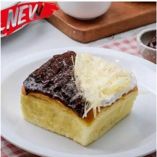 

YUMMY CAKE KEJU DENGAN TOPPING COKELAT CRUNCHY DAN KEJU KRIWIL (UKURAN 10 CM X 10 CM)