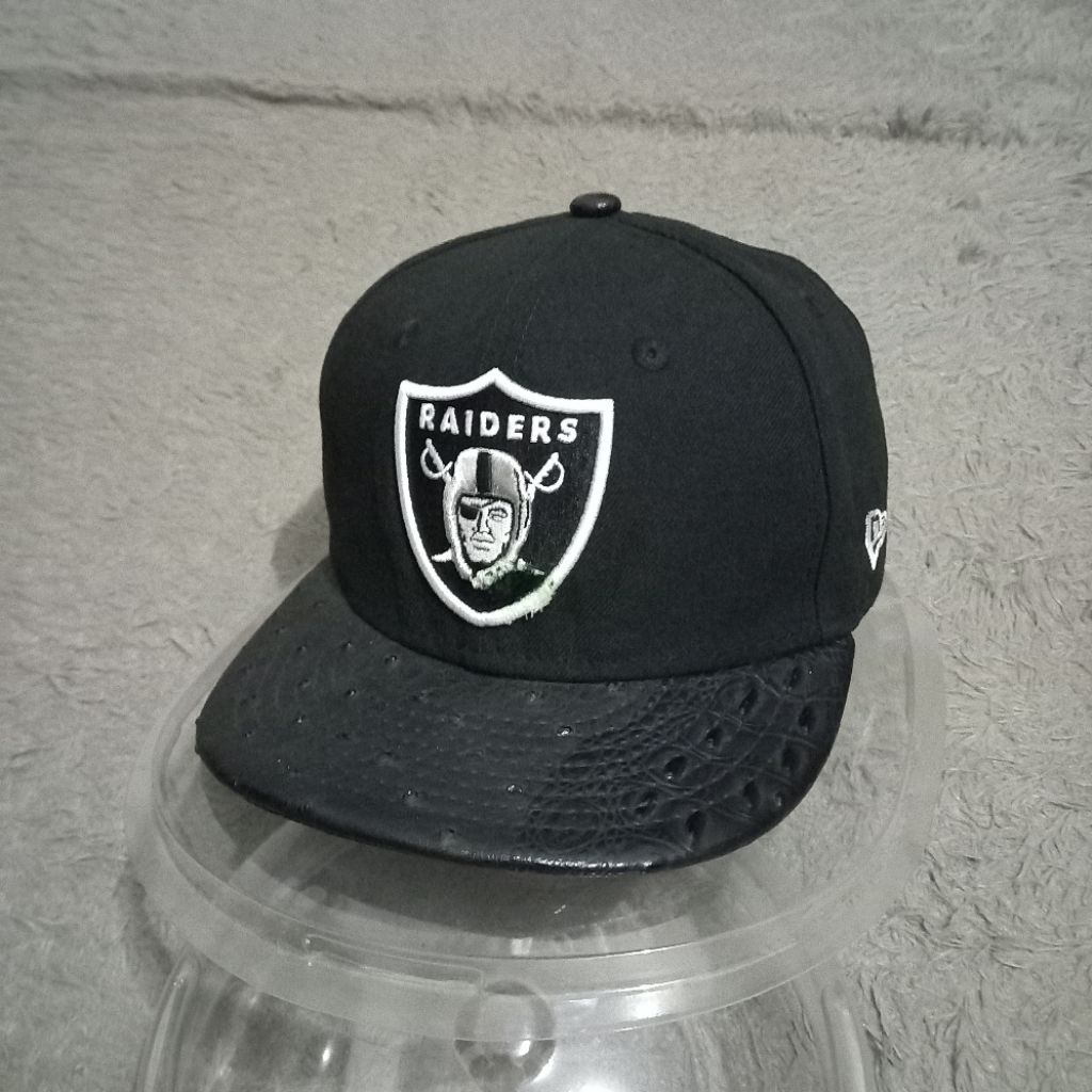 Topi snapback raiders original dari new era foto sendiri